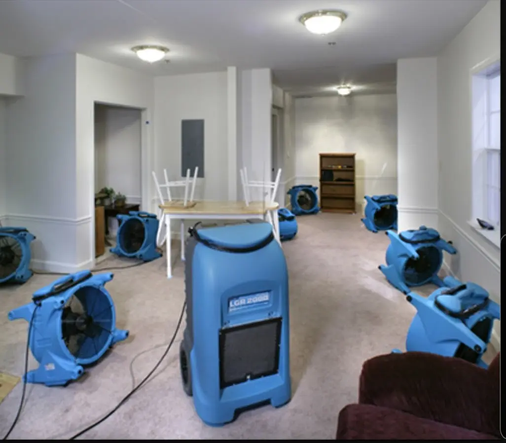 Air movers and dehumidifier setup for Water Damage Restoration in St. Ann